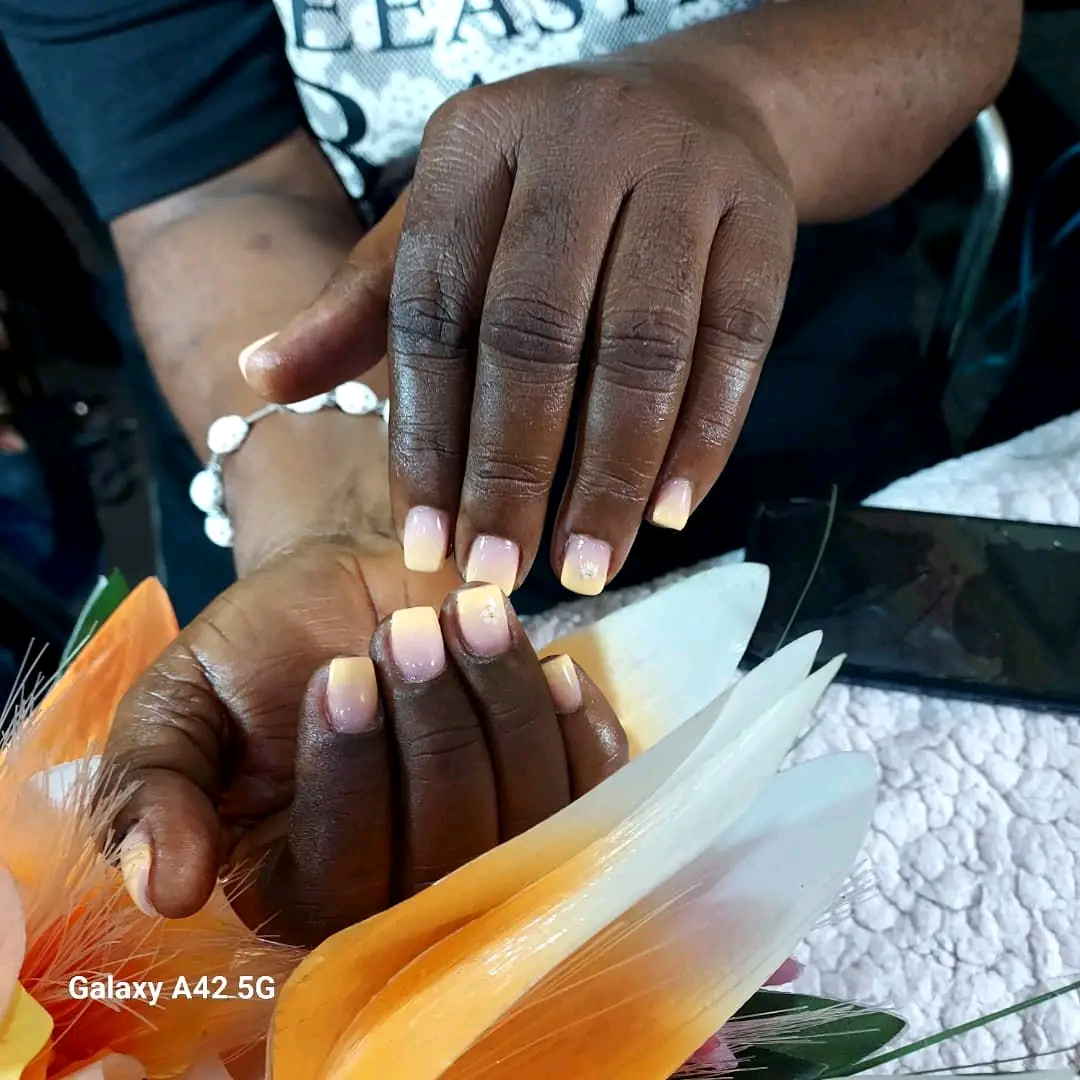 Mbewe's nails